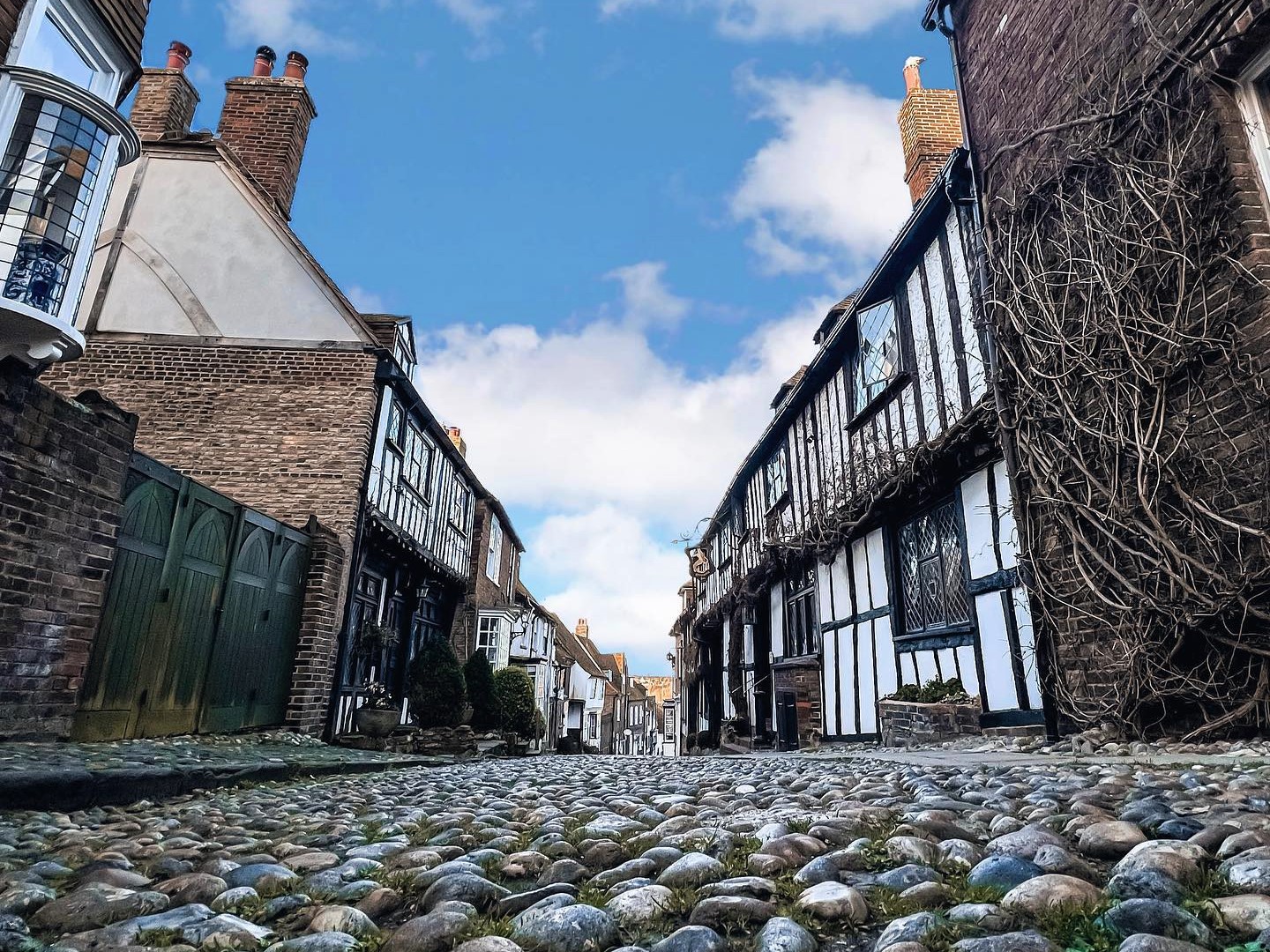 low level view of Rye cobbled street with old timber buildings